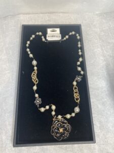 gold and pearl black necklace